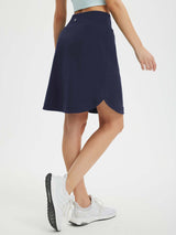Navy blue women's running skort with UPF 50+ protection, side slits, and zipper pocket. #color_Navy Blue