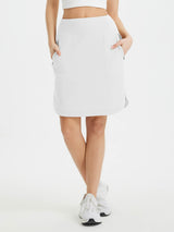 Women's white UPF 50+ quick-dry athletic skort with built-in shorts and zip pockets. #color_White
