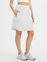 Women's white UPF 50+ quick-dry running skort w/ zipper pocket & inner shorts. #color_White