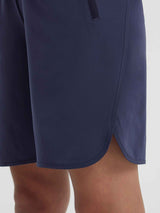 Navy blue women's 9-inch running shorts with stylish curved hem and functional side slit. #color_Navy Blue