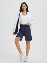 Navy blue Women's 9" high-waisted running shorts with secure side zipper pocket, on model. #color_Navy Blue