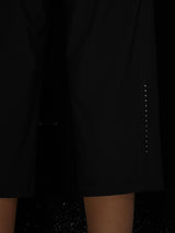 Black women's athletic capris with reflective side details and textured fabric. #color_Black