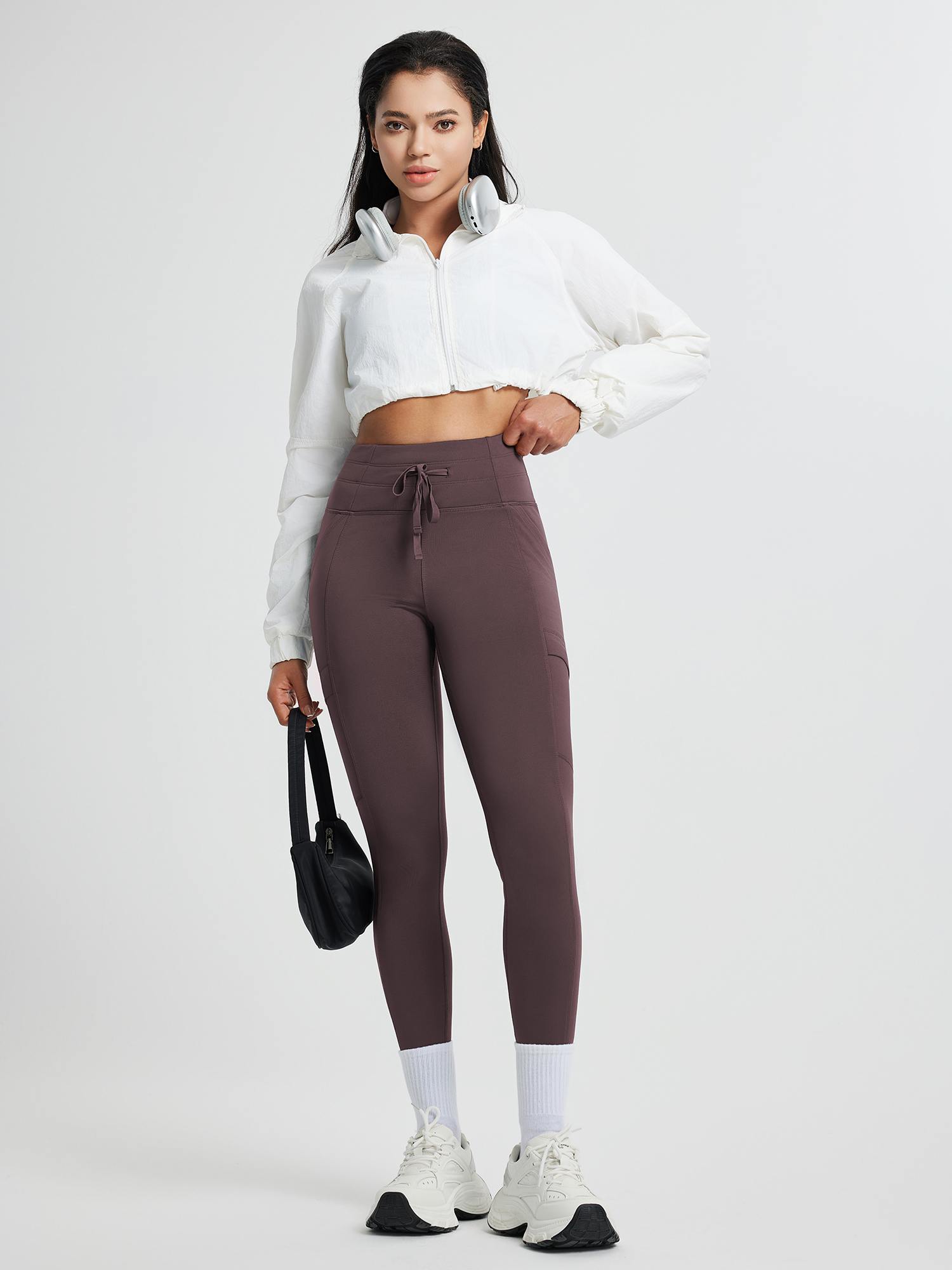 Running high-waisted fleece leggings in deep brown with drawstring and pockets
