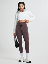 Running high-waisted fleece leggings in deep brown with drawstring and pockets
