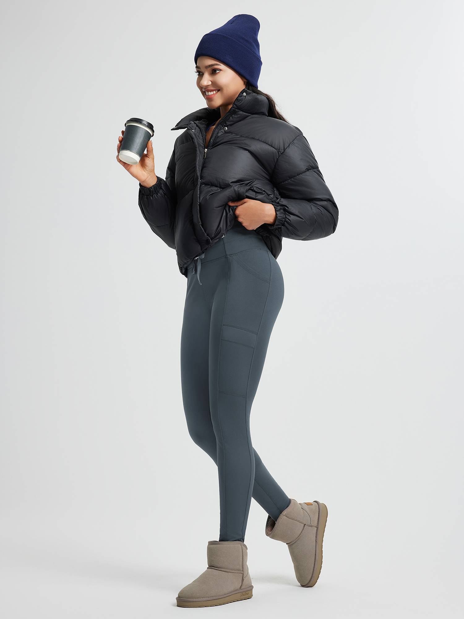 High-waisted fleece running leggings with pockets, black puffer jacket and beanie. #color_Charcoal Gray