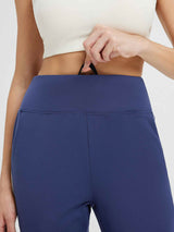 Navy blue fleece-lined running joggers with flat high waist and adjustable drawcord. #color_Blue/White