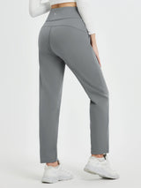 Women's grey heavyweight thermal fleece tapered running pants with high waist, back view.