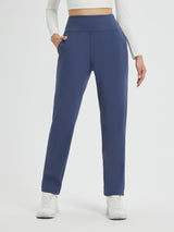 Women's navy blue heavyweight thermal fleece tapered running pants with pockets.