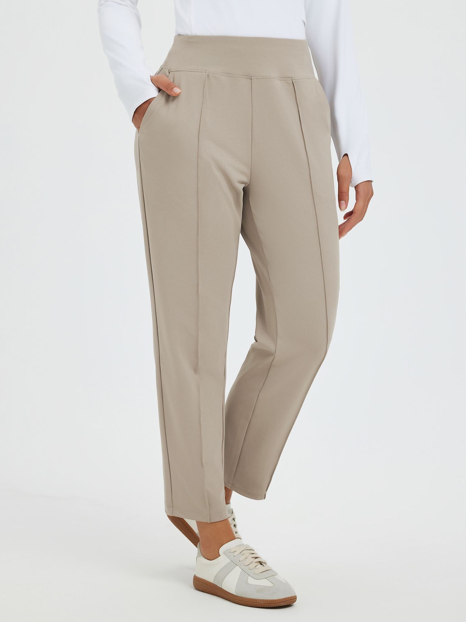Beige tapered running pants with pouch pockets, high waist, center seam. #color_Teak Brown