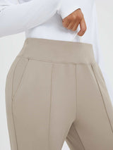Beige tapered running pants with high waist, drawstring, and deep pouch pockets. #color_Teak Brown