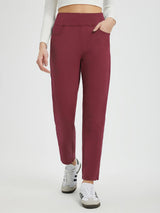Running flat-waist fleece tapered pants in maroon with pockets and ribbed side panels. #Color_Wine Red