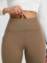 Brown fleece-lined running tights with high waist and deep cross pockets. #color_Cocoa Brown