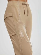Beige women's fleece running pants with water-repellent patchwork pockets. #color_Tea Brown