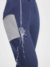 Navy women's running pants with grey patchwork detail, showcasing water-repellent fabric. #color_Navy Blue