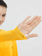 Yellow running long-sleeve top with thumbhole cuff detail and chest pocket. #color_Yellow