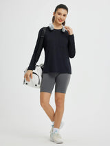 Black running crewneck long-sleeve pocket top on model with gym bag #color_Black