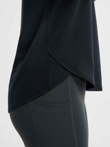 Black long-sleeve running t-shirt with crossover hem detail. #color_Black