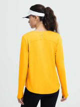 Back view of woman wearing bright yellow long-sleeve running t-shirt and black leggings, white visor. #color_Yellow