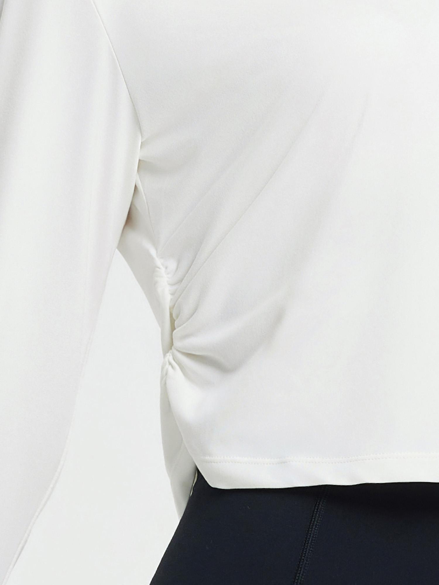 White women's long-sleeve running shirt featuring side ruching for a slimming fit. #Color_Star White