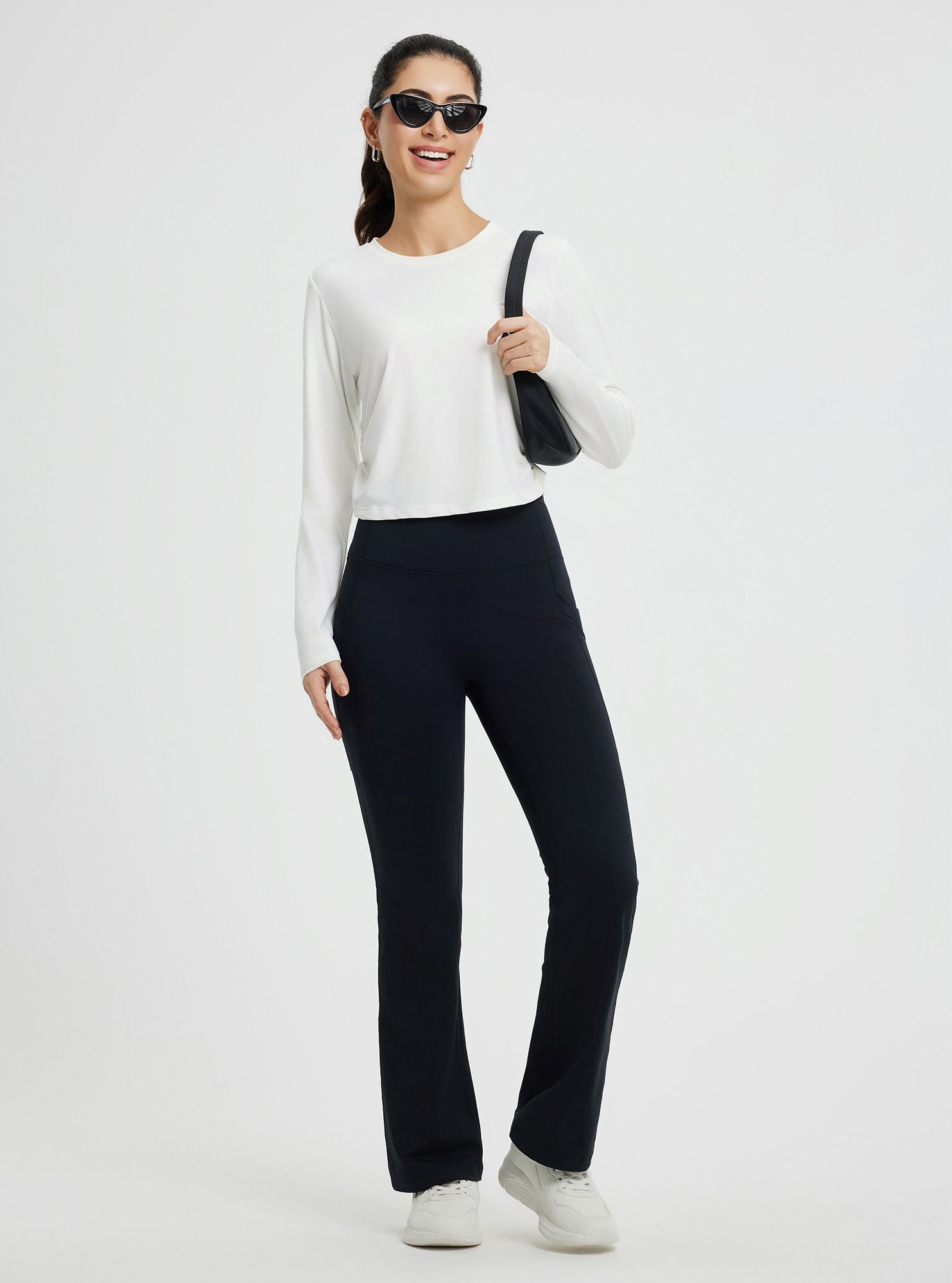 Women's white slim-fit long-sleeve crew-neck running t-shirt with curved hem