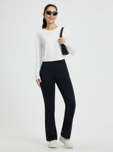 Women's white slim-fit long-sleeve crew-neck running t-shirt with curved hem
