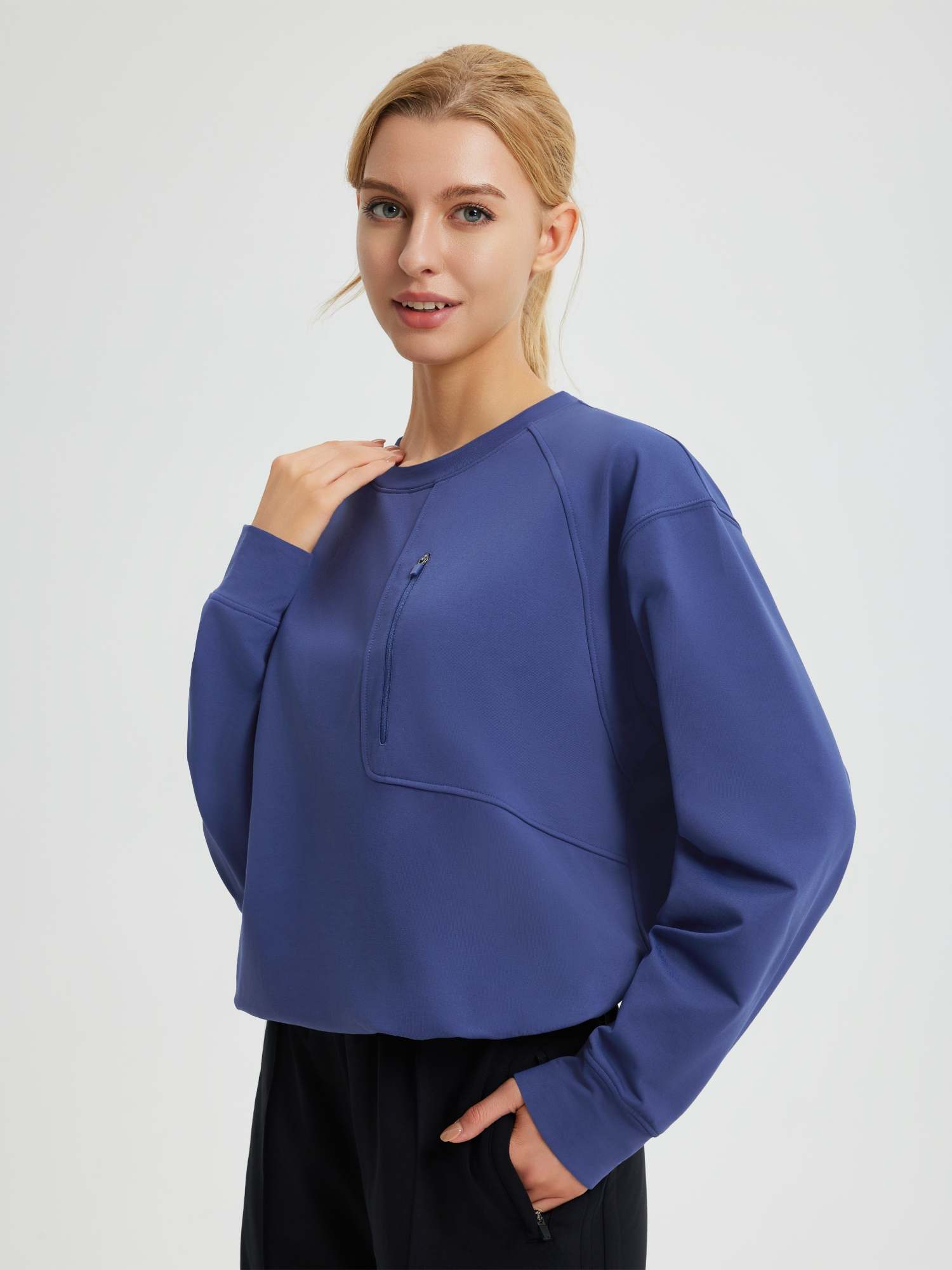 Blue women's raglan fleece running top with quarter-zip chest pocket. #color_Navy Blue