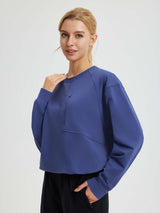 Blue women's raglan fleece running top with quarter-zip chest pocket. #color_Navy Blue