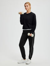 Women's black fleece raglan long-sleeve top with zipper pocket #color_Black