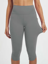 Women's grey 17" high-waisted capris with side pockets, showcasing stretch fabric. #color_Dark Gray