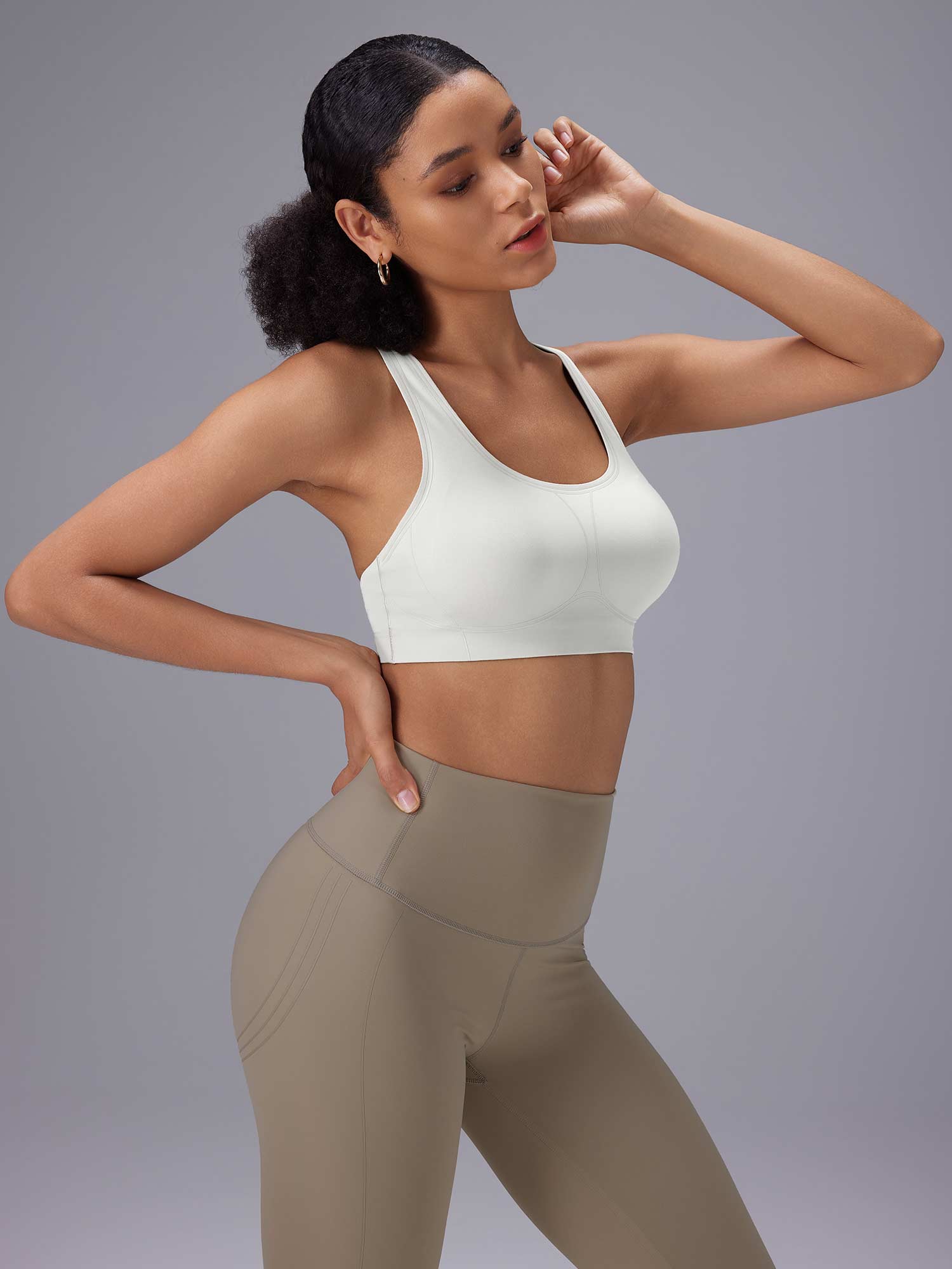 White low-impact sports bra and taupe high-rise yoga shorts for Everyday Yoga Comfort Set. #color_White