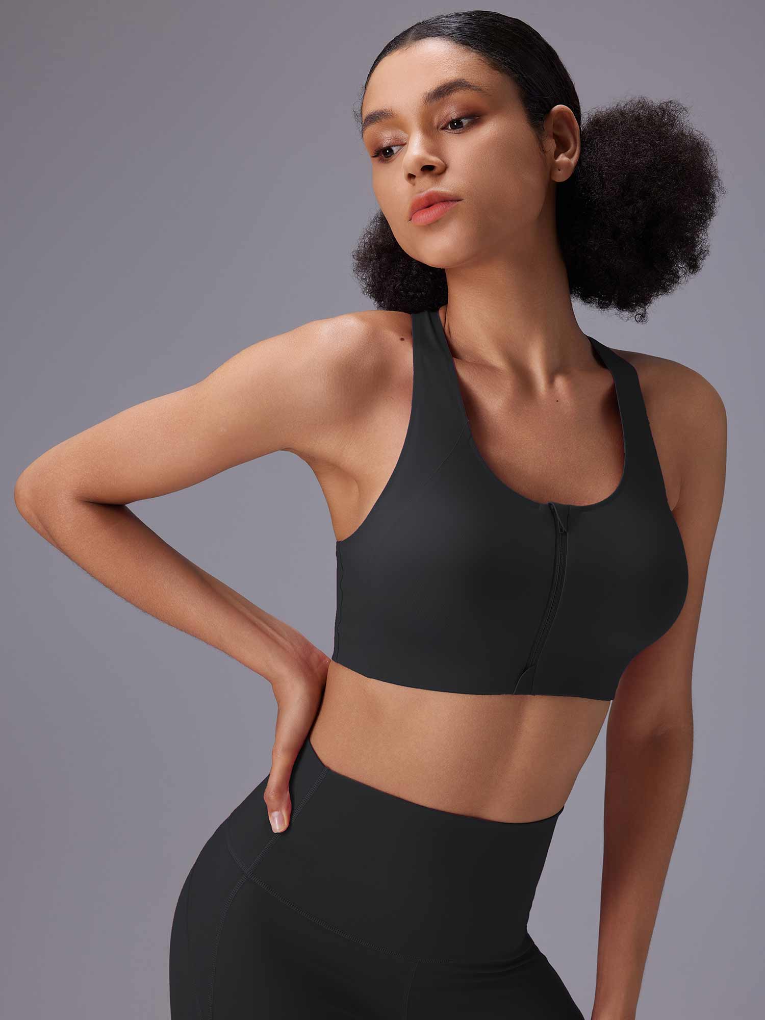 Black front zip sports bra and high-rise shorts for high-impact training. #color_Black