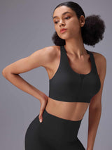 Black front zip sports bra and high-rise shorts for high-impact training. #color_Black