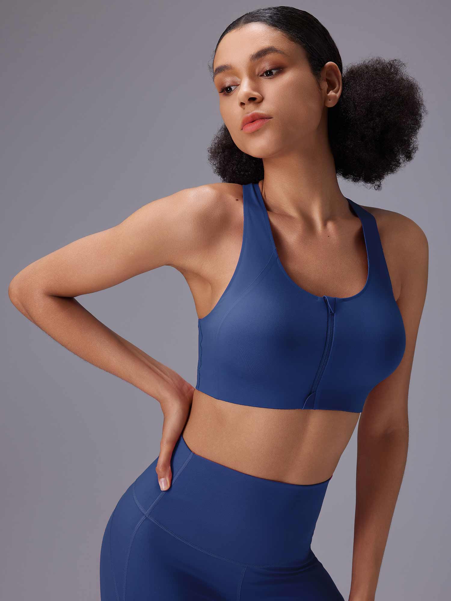 Women's blue front zip sports bra and high-rise Bermuda shorts set. #color_Blue