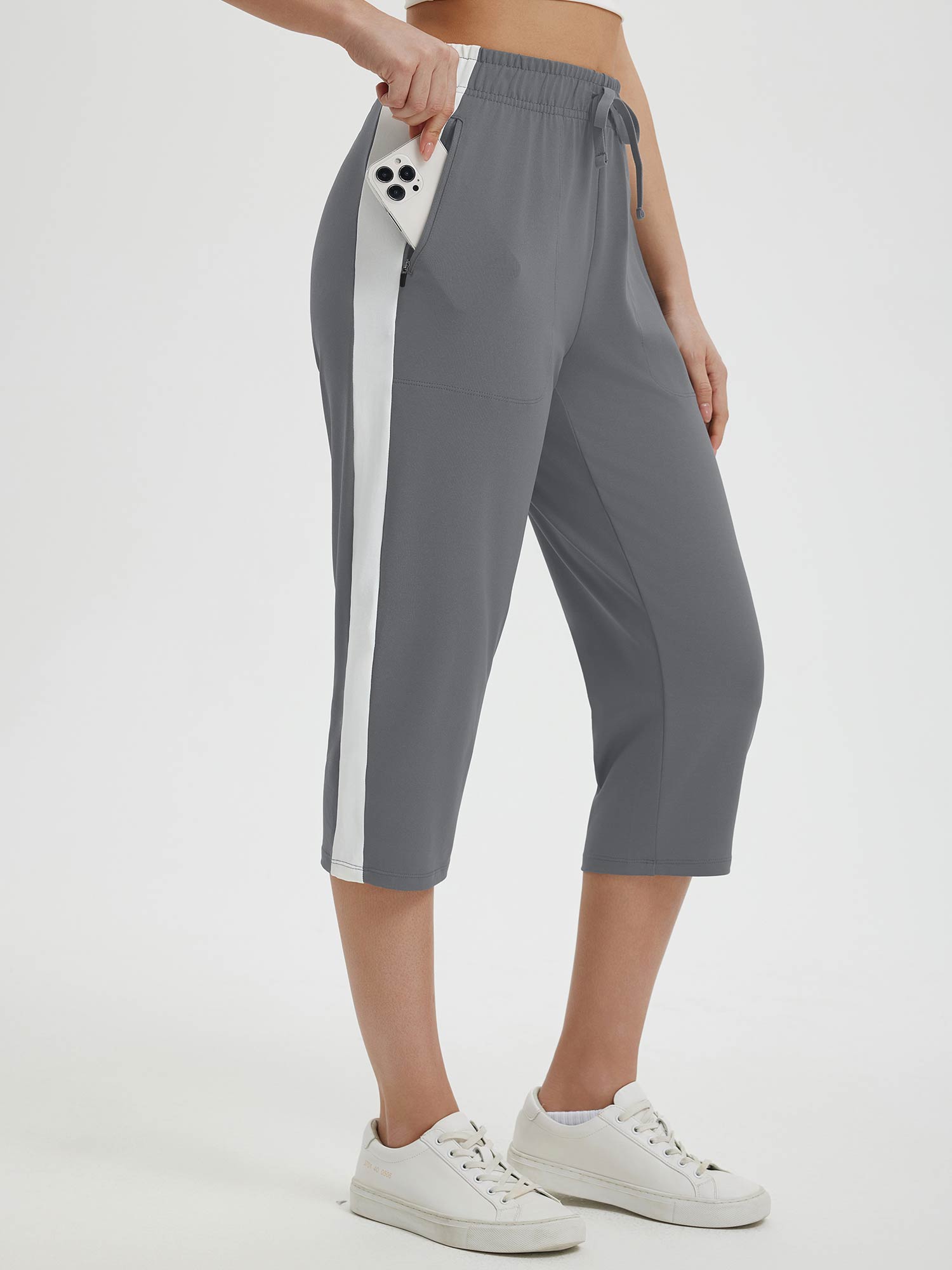 Women's gray 19" quick-dry yoga capri pants with white side stripe and phone pocket #color_Dark Gray