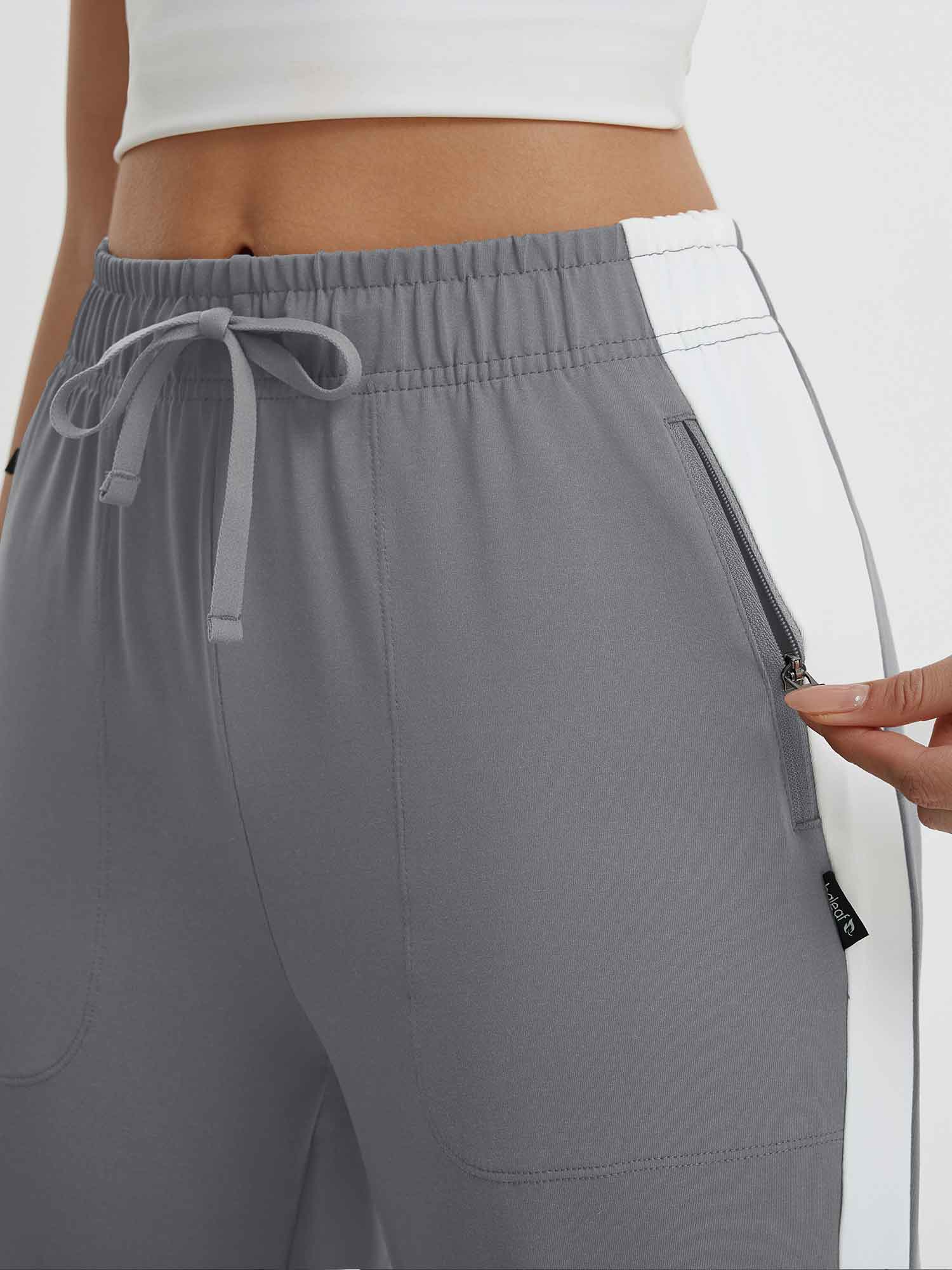 Gray women's 19" quick-dry yoga capri pants with drawstring and zippered pocket. #color_Dark Gray