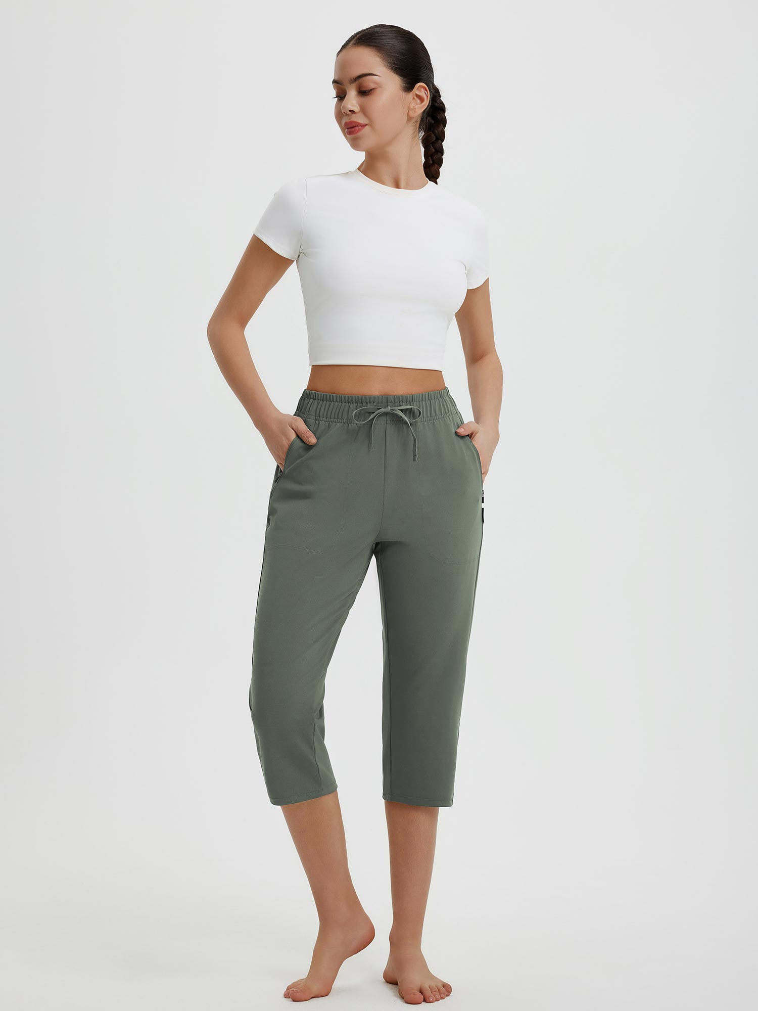 Olive green women's 19" quick-dry yoga capri pants with drawstring and zippered pocket. #color_Army Green
