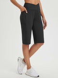 Black 14" high-rise Bermuda shorts with pockets and criss-cross waistband. #color_Black