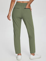 Sculpt High-Waist Tapered Yoga Pants in olive green, showing back pockets and split hem. #color_Army Green