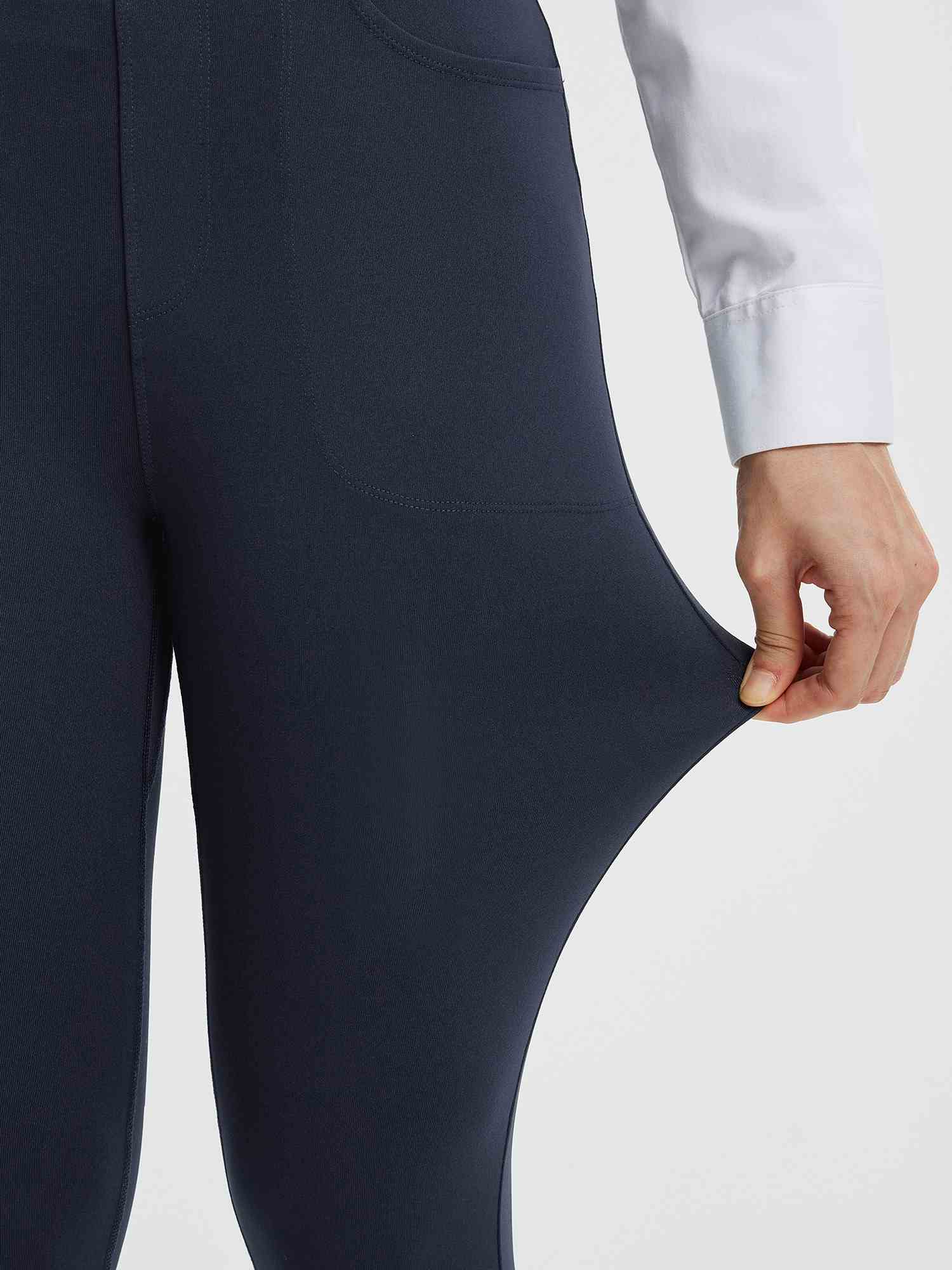 Women's navy blue business pants fabric showing stretch. Polyester spandex blend. #color_Navy Blue