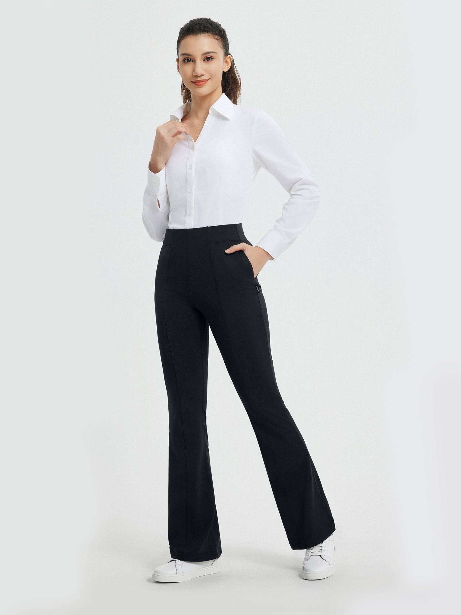 Women's black high-waisted bootcut pants for business, yoga, with side zip pocket. #Color_Black