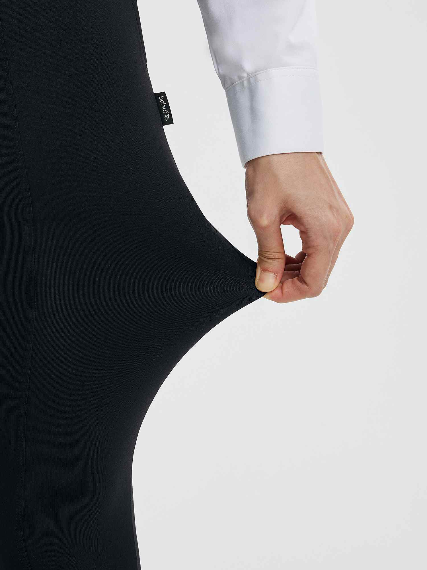 Black high-waisted flared yoga business pants fabric stretch, baleaf logo visible. #Color_Black