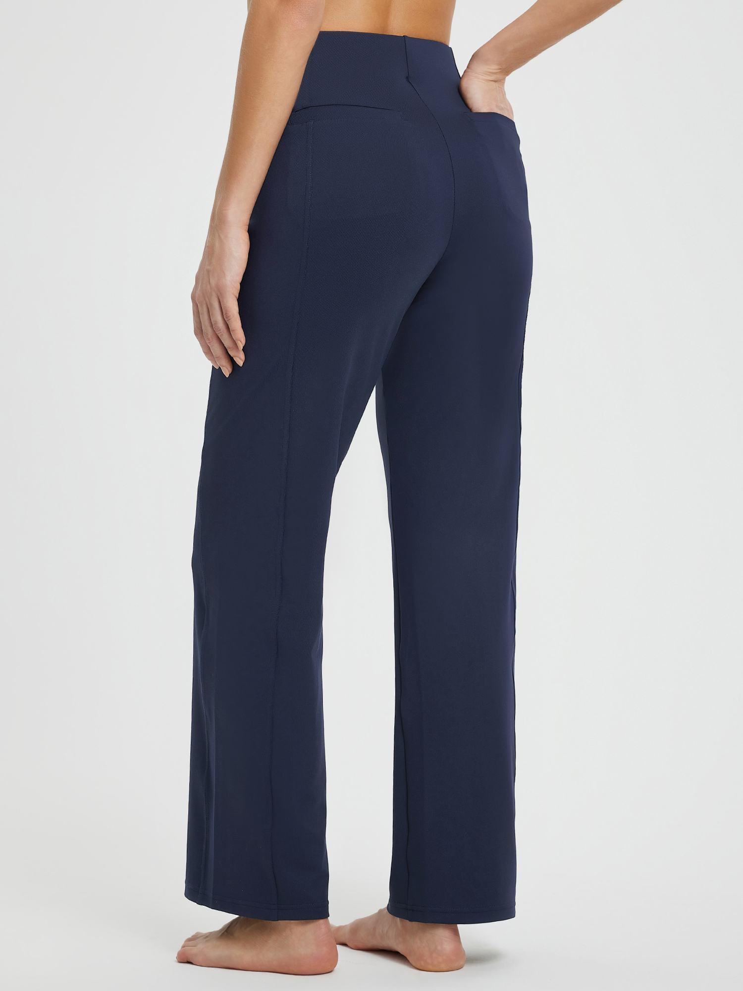 Navy blue Yoga Commuter High-Waisted Wide-Leg Pants with pockets, back view. #Color_Navy Blue
