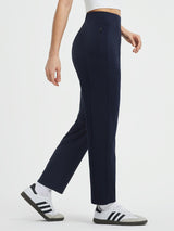 Navy blue high-waisted tapered yoga pants with zippered thigh pocket. #color_Navy Blue