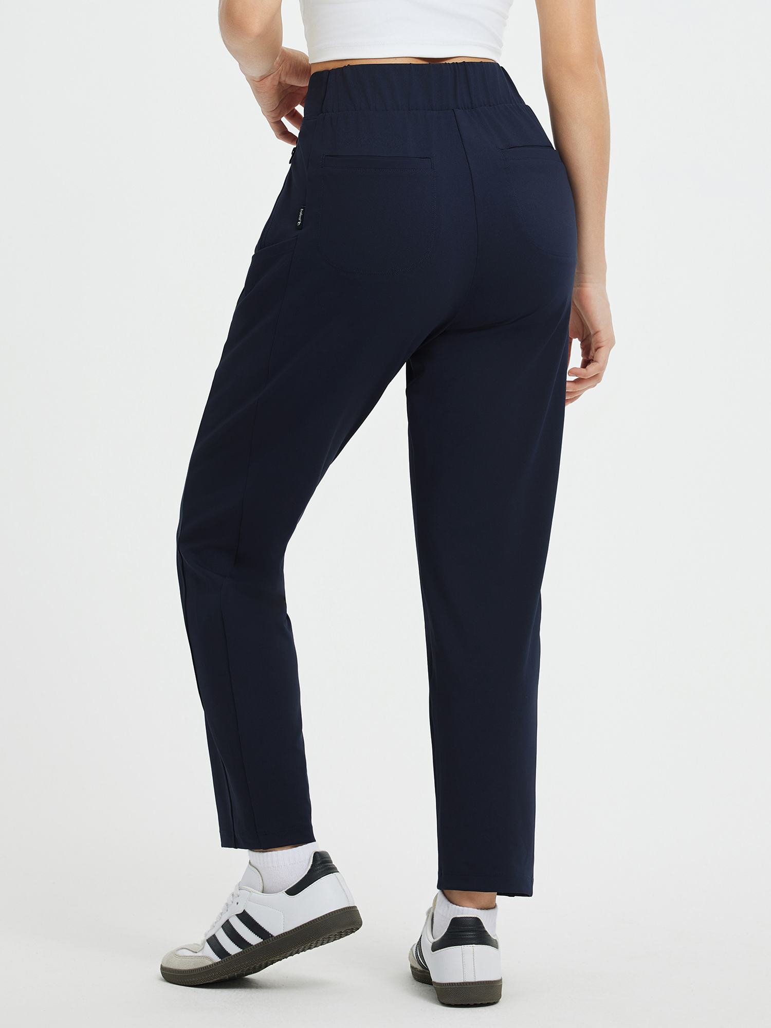 Navy high-waisted tapered yoga pants with 7/8 ankle length, side pockets, Bengol label. #color_Navy Blue