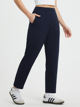 Yoga High Waisted Tapered Pants in navy blue with ankle length and pockets. #color_Navy Blue