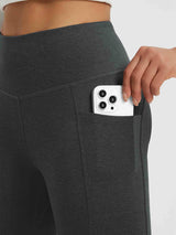 Women's dark grey high-waisted yoga pants with V-seam and phone pocket. #color_Black