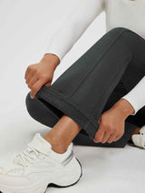 Women's dark grey fleece-lined high-waisted flared yoga pants with visible leg seams.