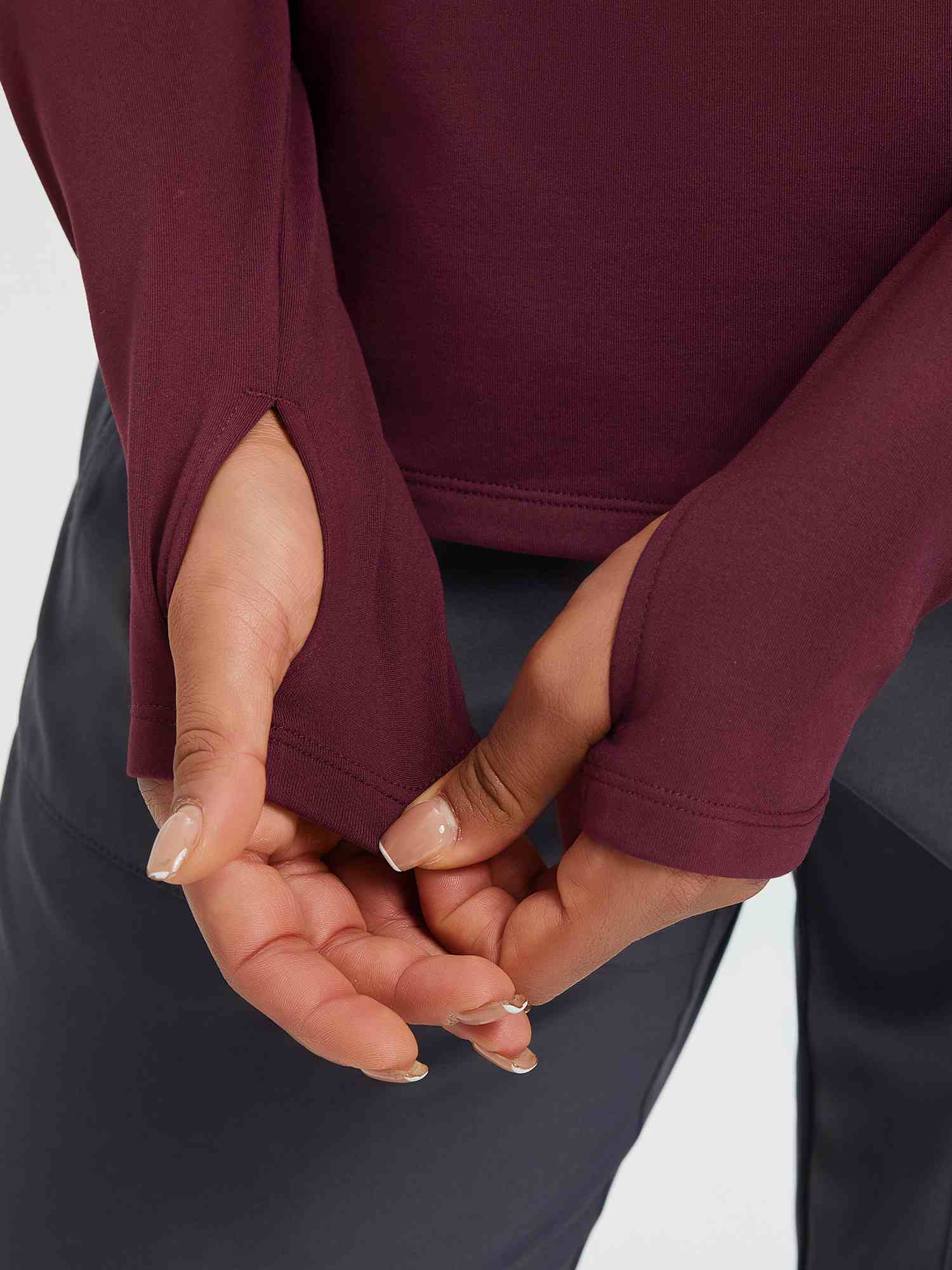 Burgundy women's thermal long-sleeve yoga top with thumbholes and fleece lining. #color_Wine Red