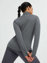 Women's grey fleece-lined yoga top with thumbholes and stand collar