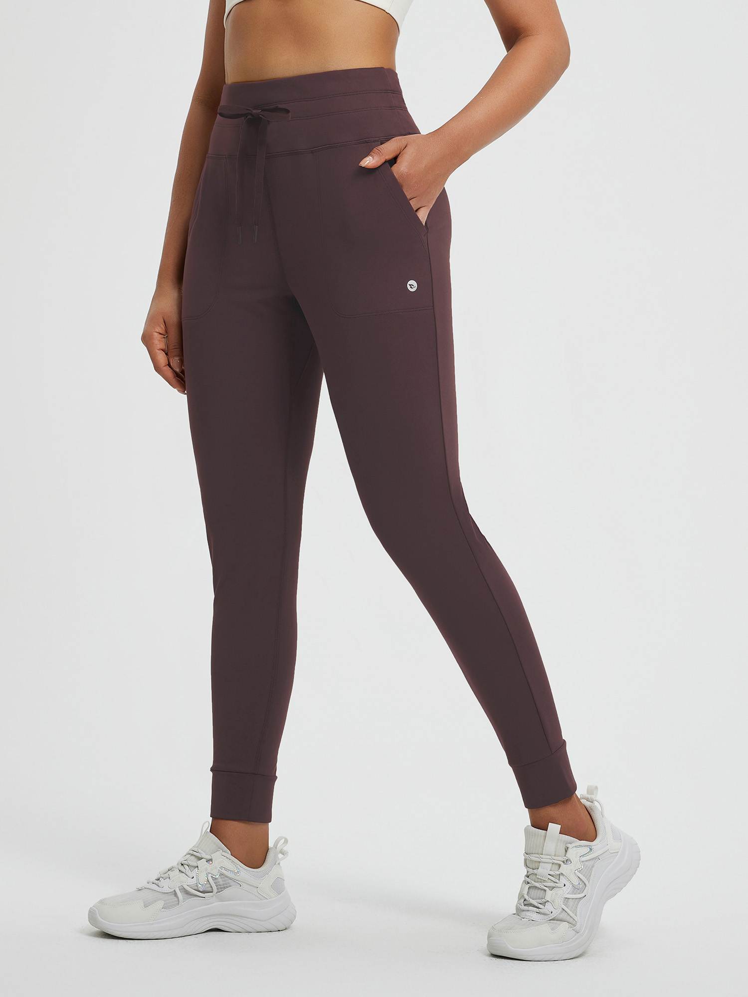 Women's dark plum fleece yoga leggings, high-waisted with pockets & cuffed ankles. #color_Dark Brown